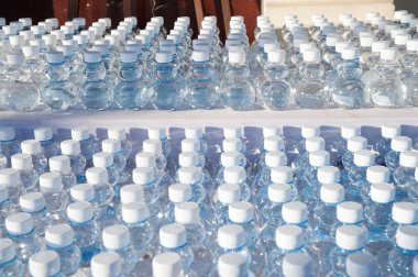 Batch plastic bottles of water.