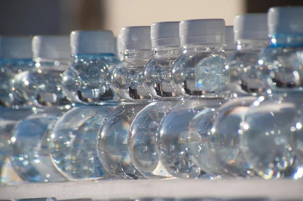 Batch plastic bottles of water.