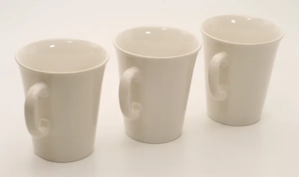 Set of three white mugs — Stock Photo, Image