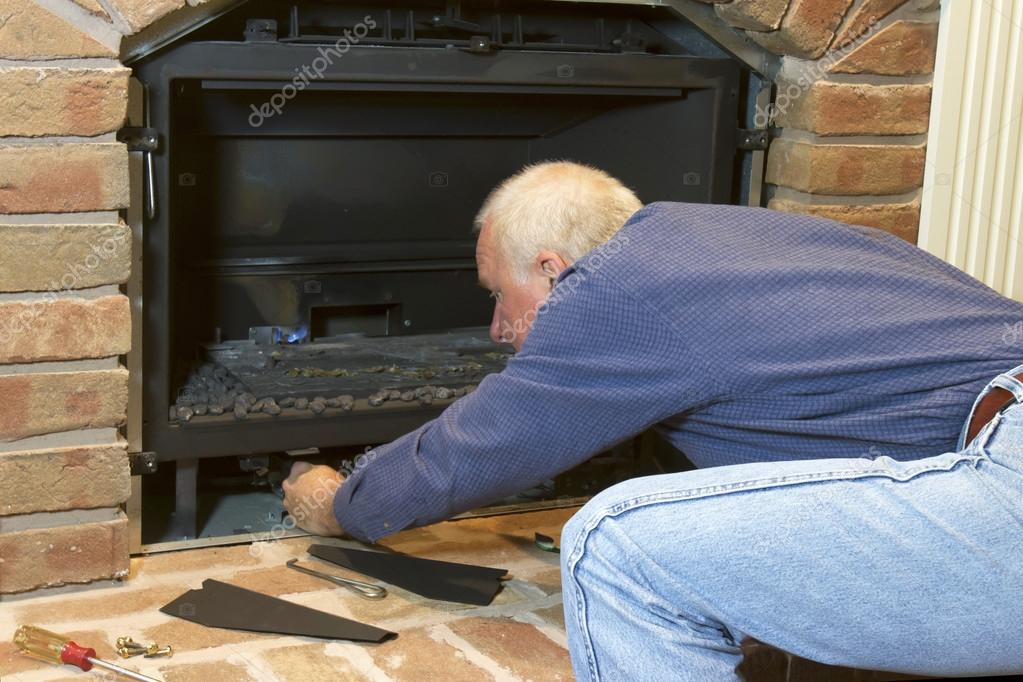 Seasonal Maintenance on Gas Fireplace — Stock Photo