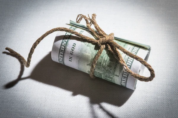 Folded banknotes tied with rope — Stock Photo, Image