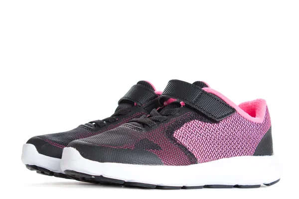 Paar rosa und schwarze Sportschuhe auf weißem Hintergrund — Stockfoto