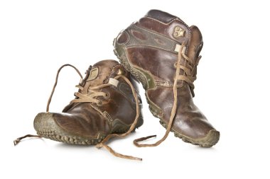 Old and dirty military boots isolated on white background clipart