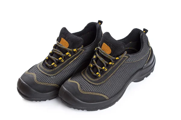 Black working boots with yellow thread on white — Stock Photo, Image