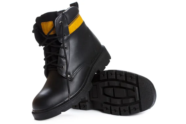 Beyaz arka plan üzerinde yüksek iş siyah deri çizmeler
