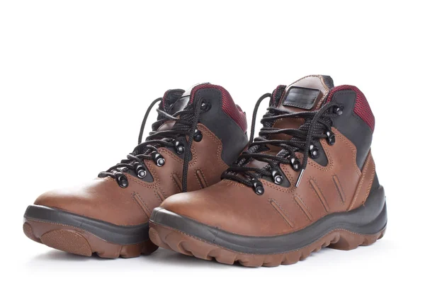 Kahverengi çalışma çifti Isolated beyaz çizmeler. 