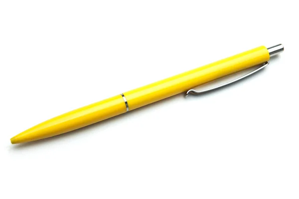 Желтая ручка на белом фоне — стоковое фото