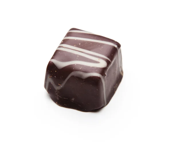 Pieza de chocolate sobre fondo blanco — Foto de Stock