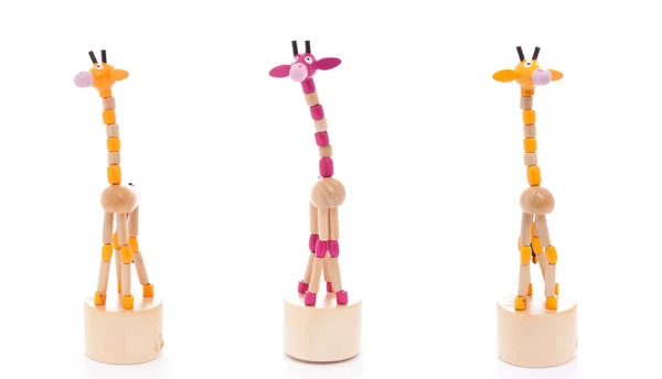 Танцующий жираф игрушка, три, изолированные на белом фоне — стоковое фото