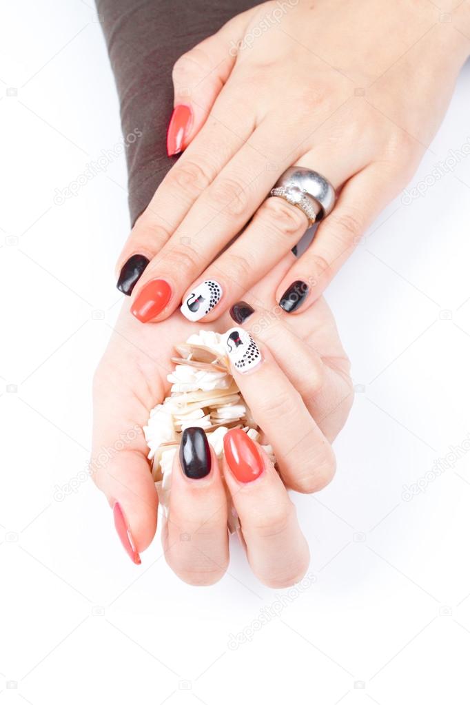 Well cared woman's hands on white with well painted fingernails