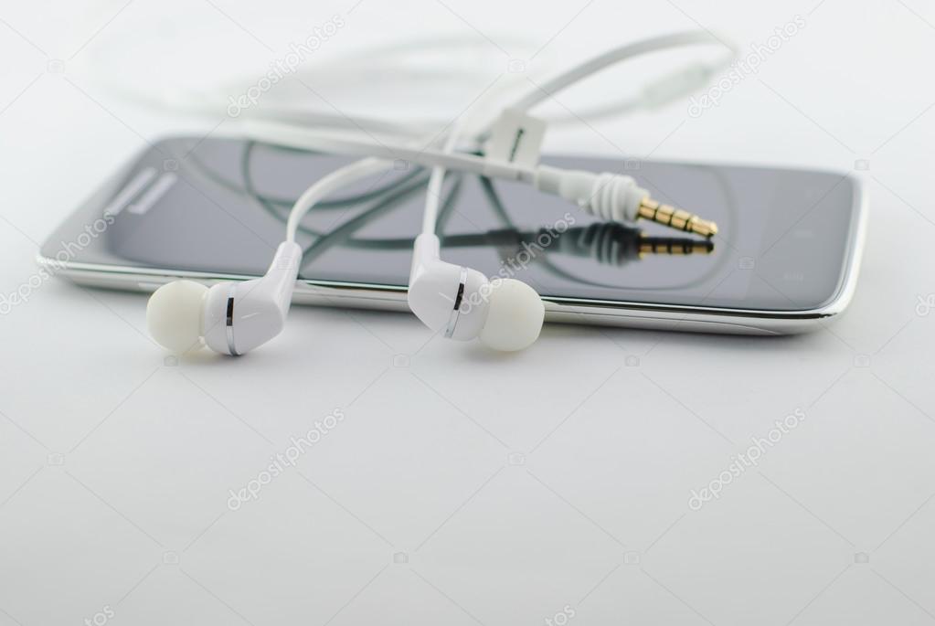 Small headphones with mobile phone 