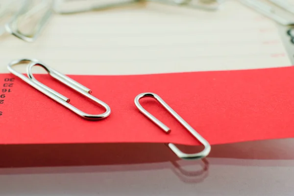 Paper clip and red paper — Stock Photo, Image