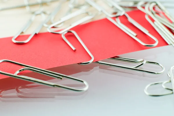 Paper clip and red paper — Stock Photo, Image