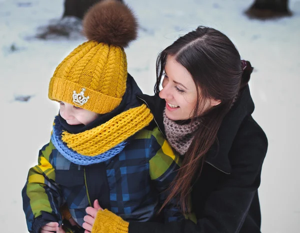 Mom and son on nature in winter