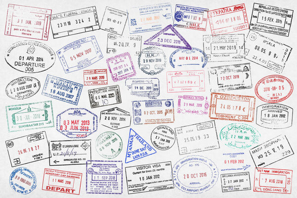 Fullframe close-up on worldwide passport stamps.