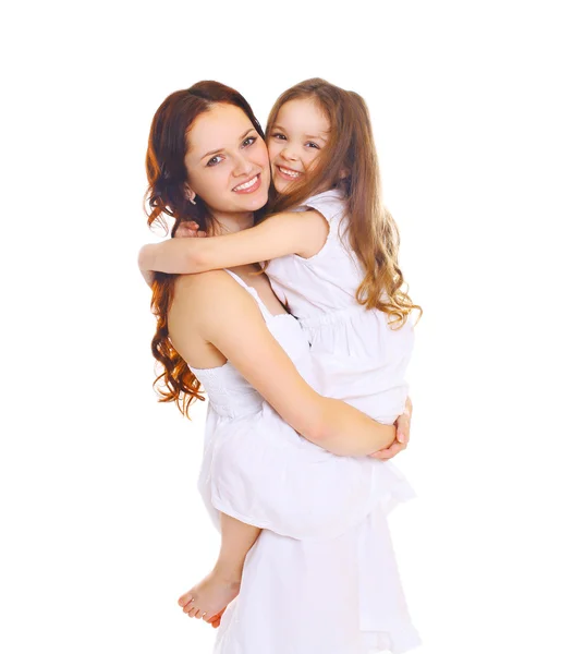 Happy smiling mother hugging little child daughter on white back — Stock Photo, Image