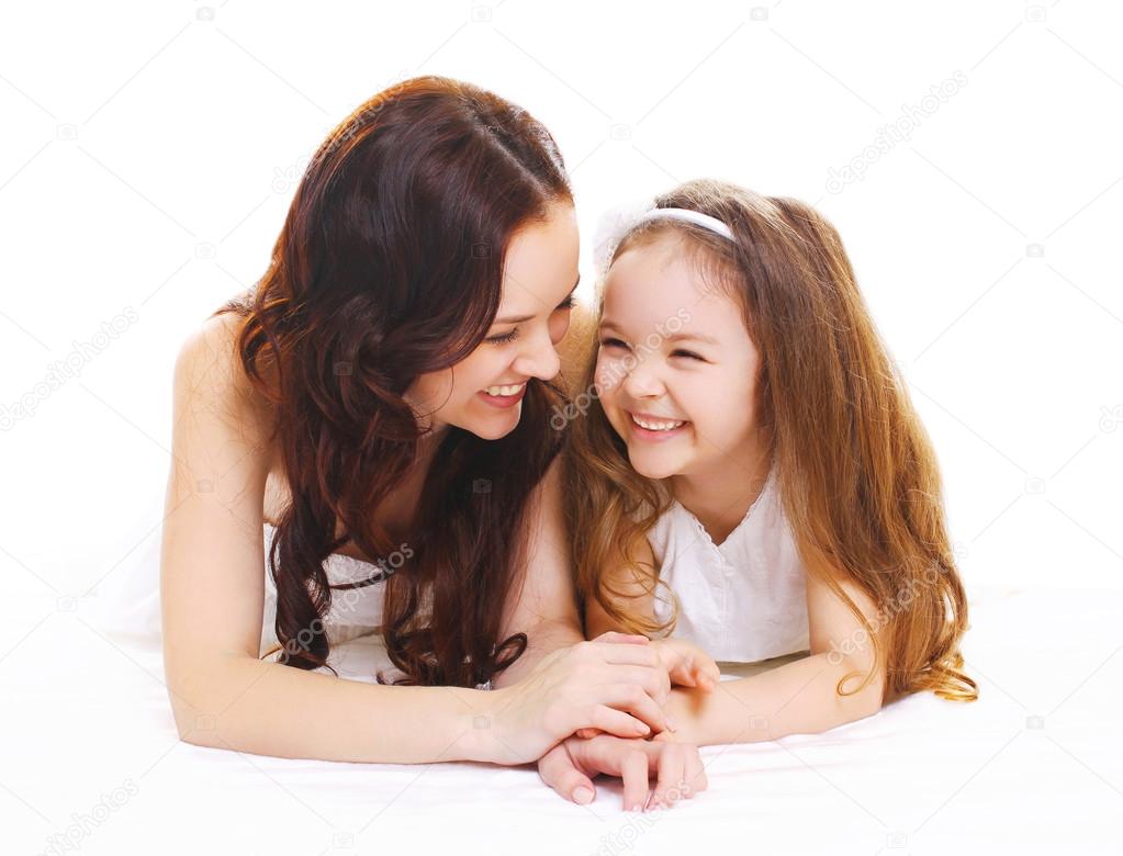 Happy smiling mother with little child daughter on white backgro