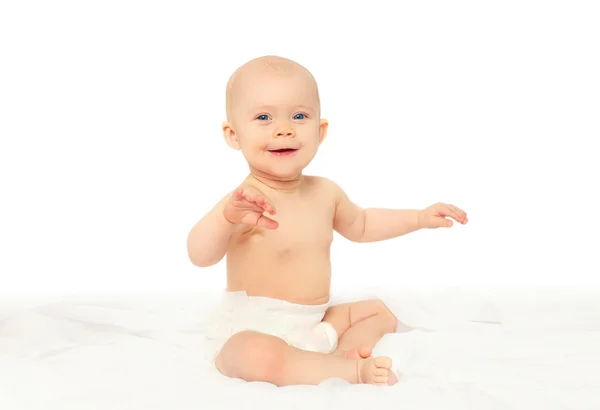 Happy smiling baby playing on bed at home — Stock Photo, Image