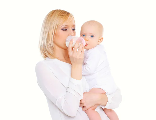 Mother feeding from bottle her baby over white background — Stock Photo, Image