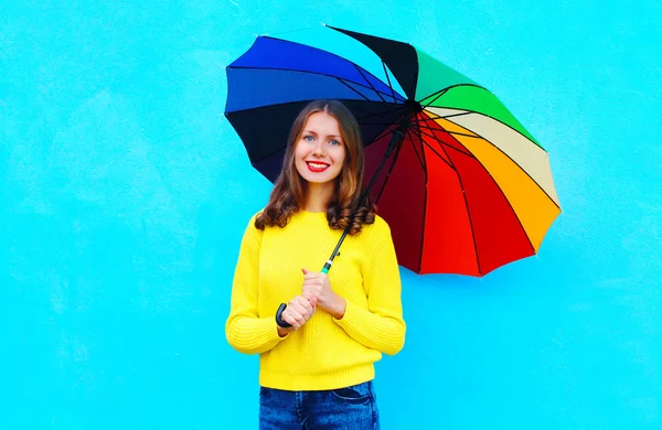 Portrait beautiful smiling woman with colorful umbrella in autum — Stock Photo, Image