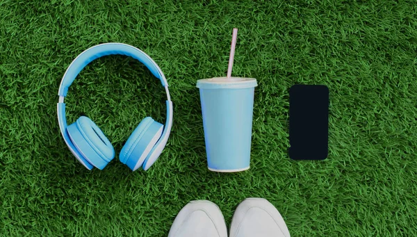 Close Blue Wireless Headphones Smartphone Cup Juice Sports Sneakers Green — Stock Fotó