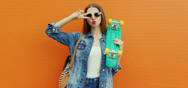 Portrait Young Woman Green Skateboard Posing Colorful Orange Background — Stock Photo, Image