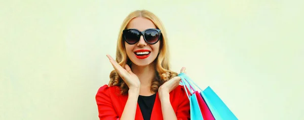 Portrait Close Laughing Surprised Young Woman Shopping Bags Wearing Red — Stock Photo, Image