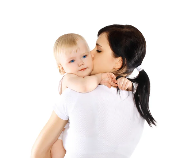 Baby and mom on a white background, happy family — Stock Photo, Image