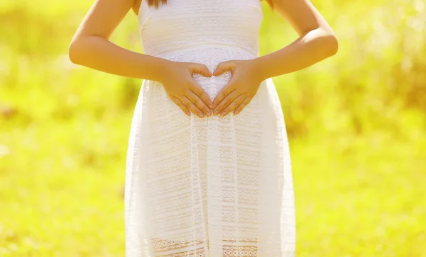 Pregnant woman hands in shape heart — Stock Photo, Image