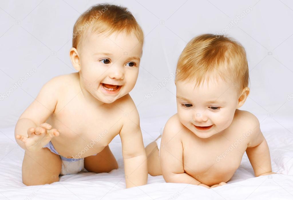 Cheerful twins on the bed