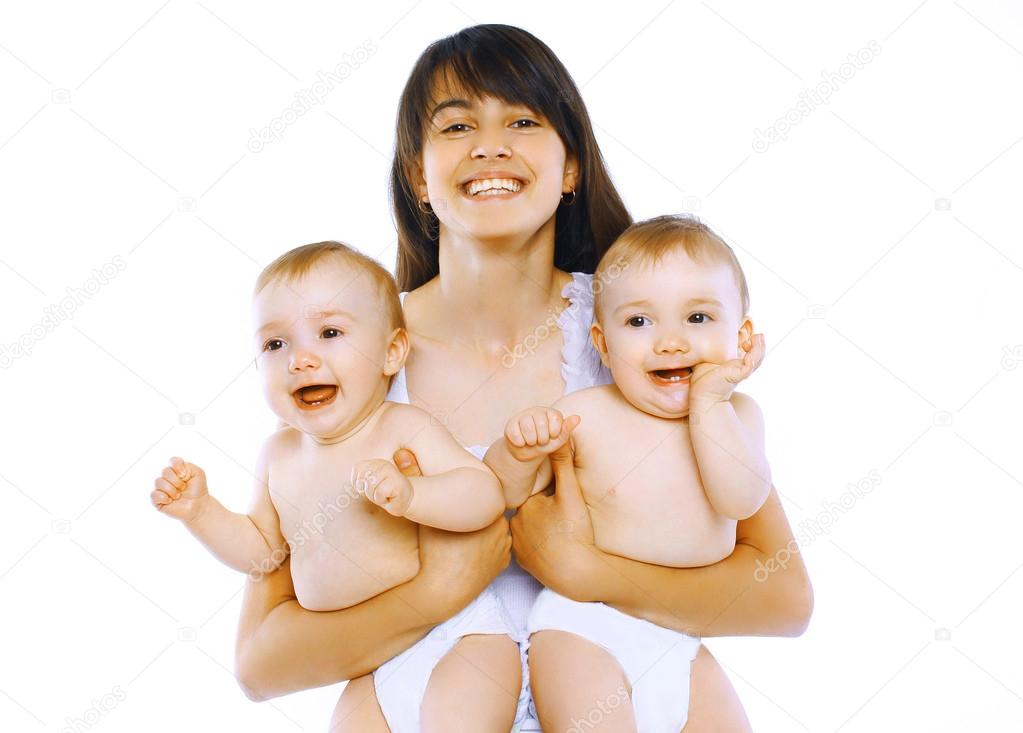 Happy young mom with two twins baby