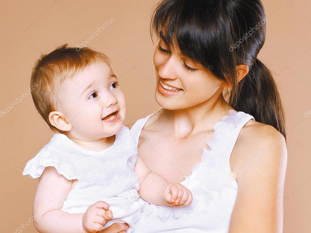 Portrait happy young mom and child