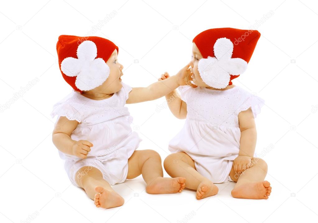 Twins baby playing