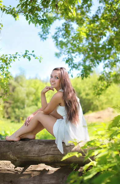 Lovely cute young girl in summer forest — Stock Photo, Image