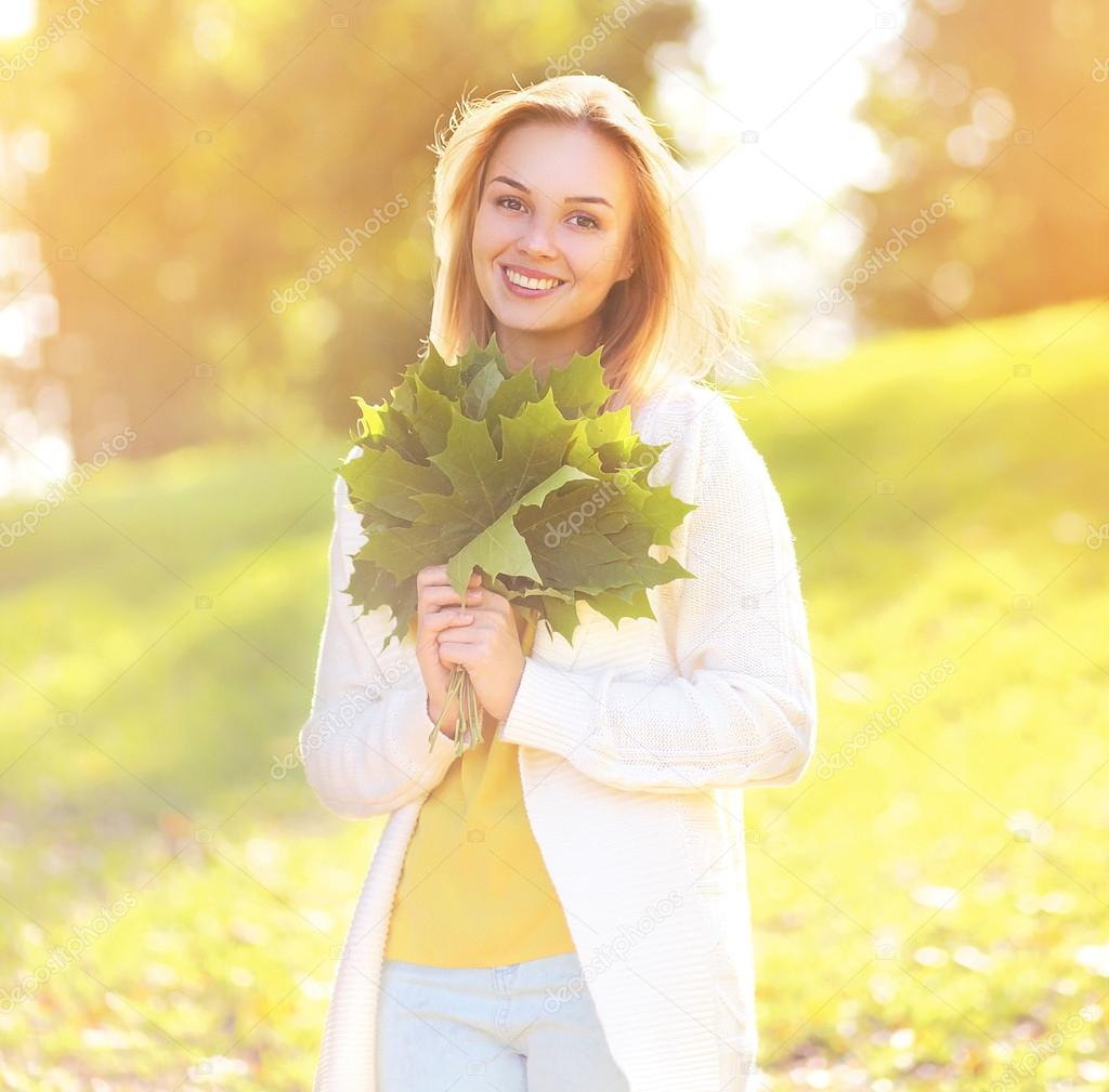 Sunny photo happy cute girl in autumn day