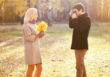 Autumn, love, relationships and people concept - happy couple ha clipart