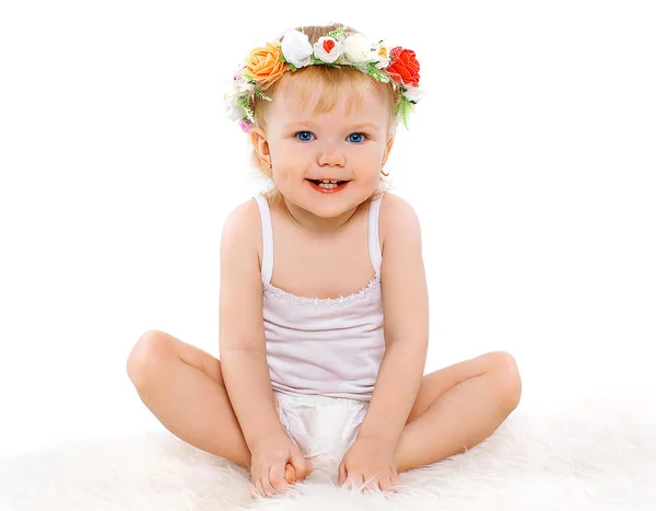 Cute baby little girl with floral wreath on his head, joyful hap — Stock Photo, Image