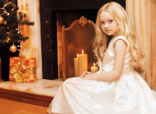 Christmas and people concept - beautiful little girl in dress ne — Stock Photo, Image