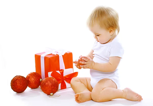 Christmas and people concept - cute little baby with christmas b — Stock Photo, Image