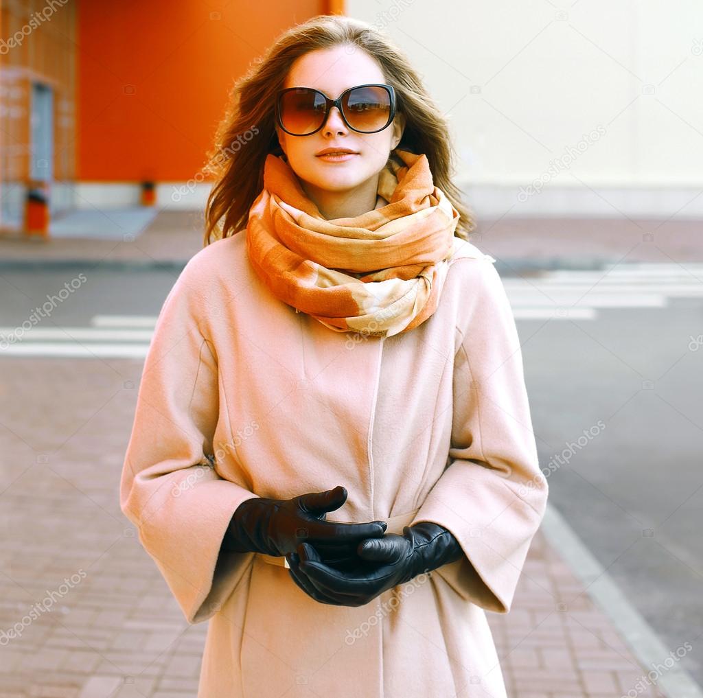 Beautiful woman in coat in the city