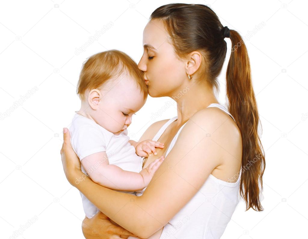 Sensual mom kiss baby on a white background