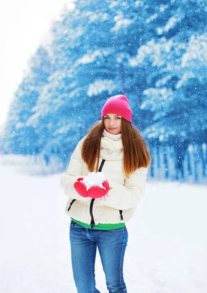 Winter and people concept - beautiful woman having fun in snowy — Stock Photo, Image