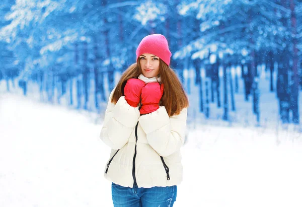 Winter and people concept - beautiful woman in snowy forest — Stock Photo, Image