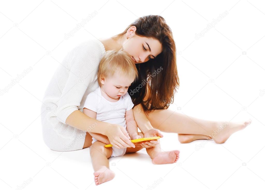Mother and baby with tablet pc on a white background