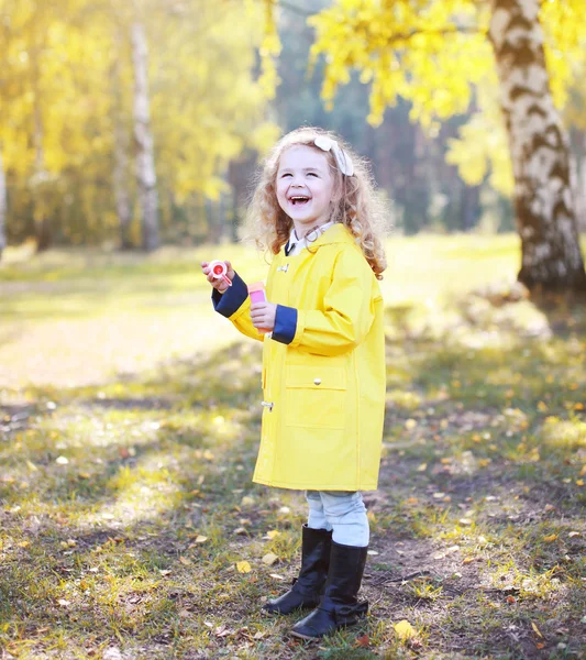 Little positive child having fun outdoors in warm sunny day — Stock Photo, Image