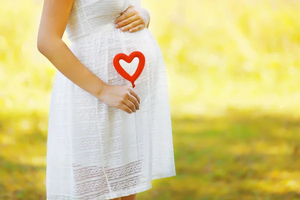 Pregnancy, maternity and new family concept - pregnant woman and Royalty Free Stock Images