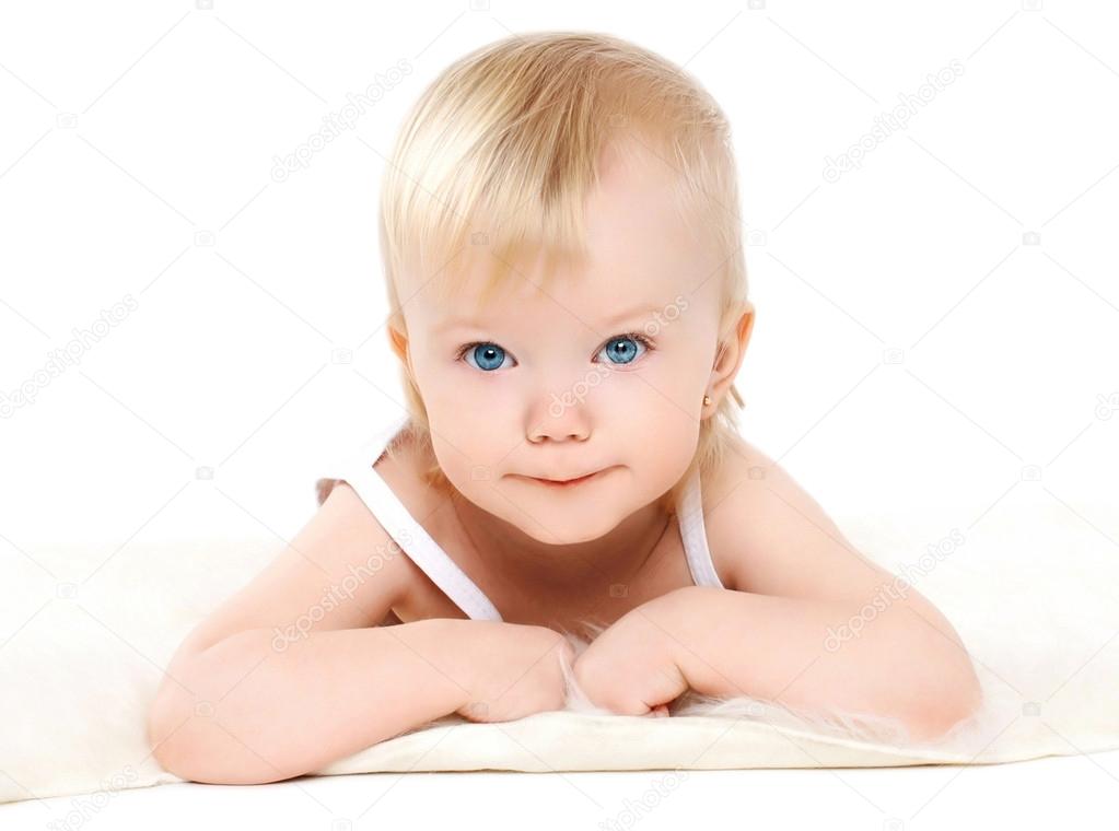 Portrait little cute baby lying on a white background