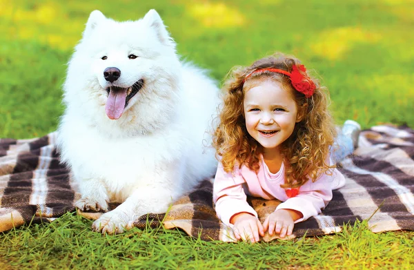 Portrait happy child and dog having fun outdoors — Stock Photo, Image