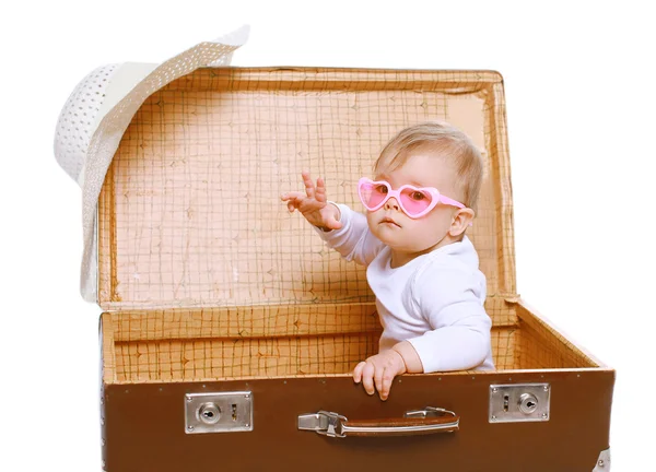 Cool baby in sunglasses playing in suitcase — Stock Photo, Image