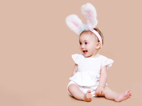 Cute baby sitting in costume easter bunny — Stock Photo, Image